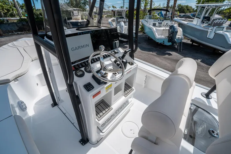 Slide: The Image of 2025 Sea Hunt BX 22 BR boat interior with Garmin navigation system and steering wheel. - 16