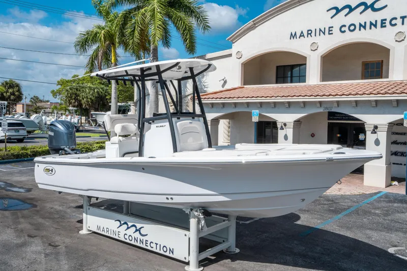 Slide: The Image of 2025 Sea Hunt BX 22 BR boat displayed at Marine Connection dealership. - 8
