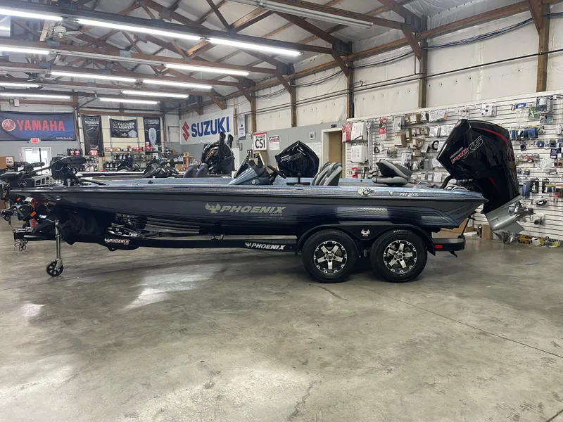 Slide: The Image of 2025 Phoenix 819 Pro boat in showroom, featuring sleek design and modern equipment. - 0
