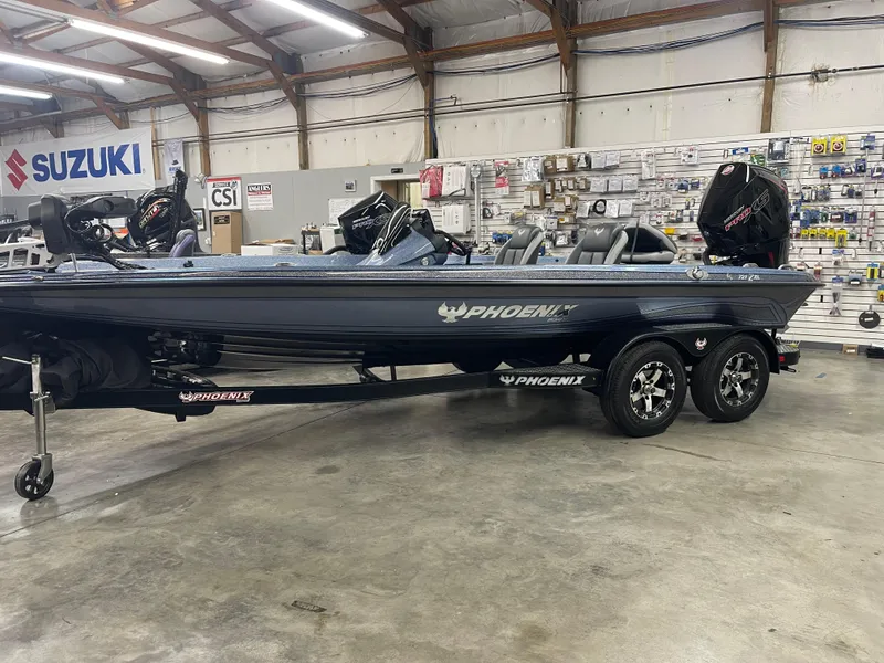 Slide: The Image of 2025 Phoenix 819 Pro boat in showroom, featuring sleek design and dual engines. - 1
