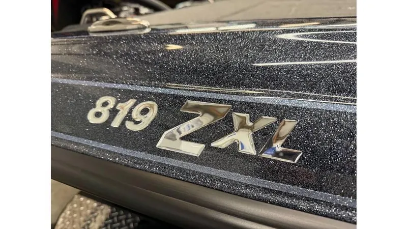 Slide: The Image of 2025 Phoenix 819 Pro boat with metallic finish and "819 ZXL" emblem. - 10