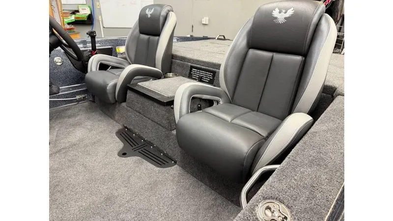 Slide: The Image of 2025 Phoenix 819 Pro boat interior with dual gray leather seats and embroidered logos. - 11