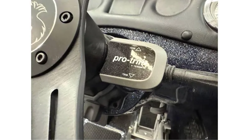 Slide: The Image of Phoenix 819 Pro 2025 boat steering wheel with pro-trim control switch. - 5