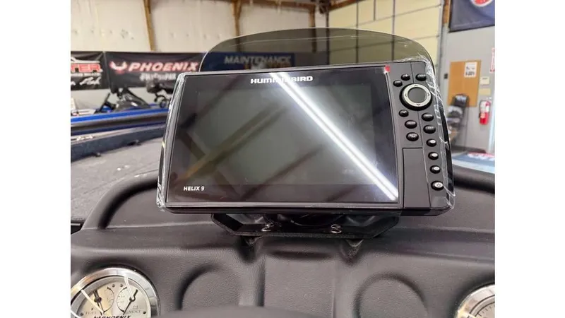 Slide: The Image of 2025 Phoenix 819 Pro dashboard with Humminbird Helix 9 fish finder display. - 6