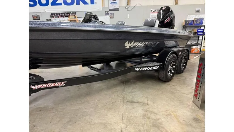 Slide: The Image of 2025 Phoenix 819 Pro boat on trailer in showroom setting. - 7