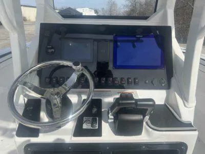 Slide: The Image of 2025 Yamaha Boats 252 FSH Sport dashboard with steering wheel and control panel. - 14