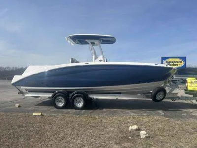 Slide: The Image of 2025 Yamaha Boats 252 FSH Sport on trailer, side view, outdoors. - 3
