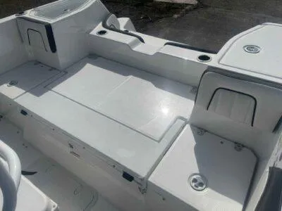 Slide: The Image of 2025 Yamaha Boats 252 FSH Sport interior, featuring spacious seating and storage compartments. - 8