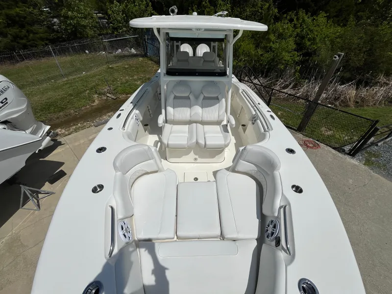 Slide: The Image of 2025 Key West 291 FS boat with spacious seating and sleek design. - 4