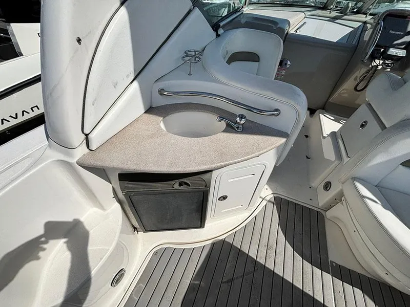 Slide: The Image of 2006 Sea Ray 320 Sundancer cockpit with sink, storage, and seating area. - 7