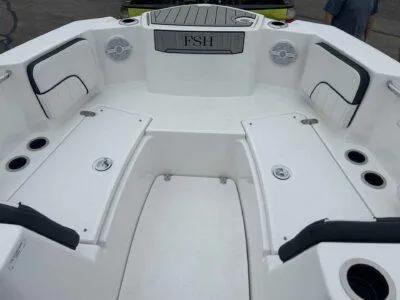 Slide: The Image of 2025 Yamaha Boats 222 FSH Sport interior, featuring spacious seating and modern design elements. - 11