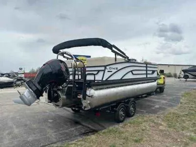 Slide: The Image of 2025 Lowe SS 210 WT pontoon boat on trailer, parked outdoors. - 3