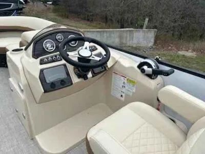 Slide: The Image of 2025 Lowe SS 210 WT boat dashboard with steering wheel and control panel. - 8