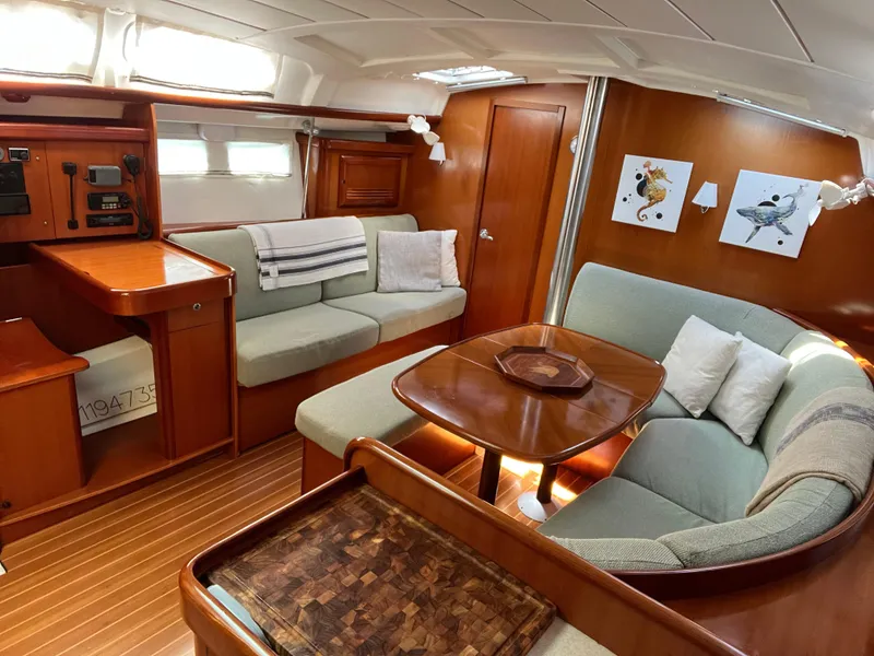 Slide: The Image of Luxurious interior of 2007 Beneteau 423 yacht with elegant wood finish and comfortable seating. - 21