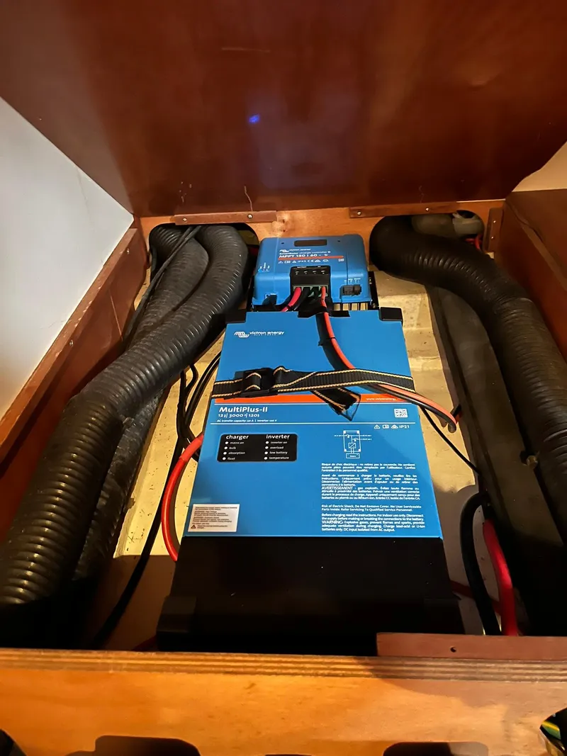 Slide: The Image of Electrical system inside a 2007 Beneteau 423 sailboat, featuring blue power inverters. - 30