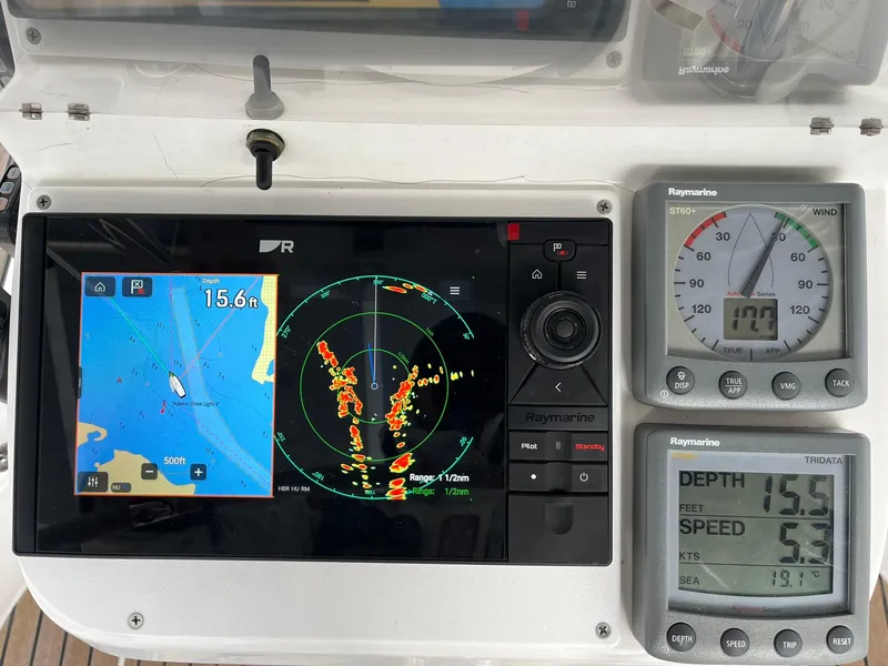 Slide: The Image of Navigation instruments on a 2007 Beneteau 423 yacht, displaying radar, depth, and speed data. - 35