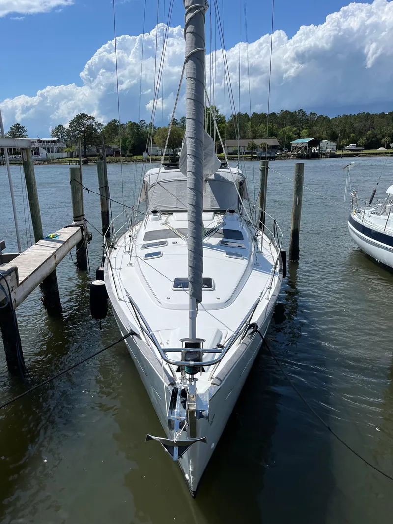 Slide: The Image of 2007 Beneteau 423 sailboat docked, front view, with clear skies and calm water. - 4