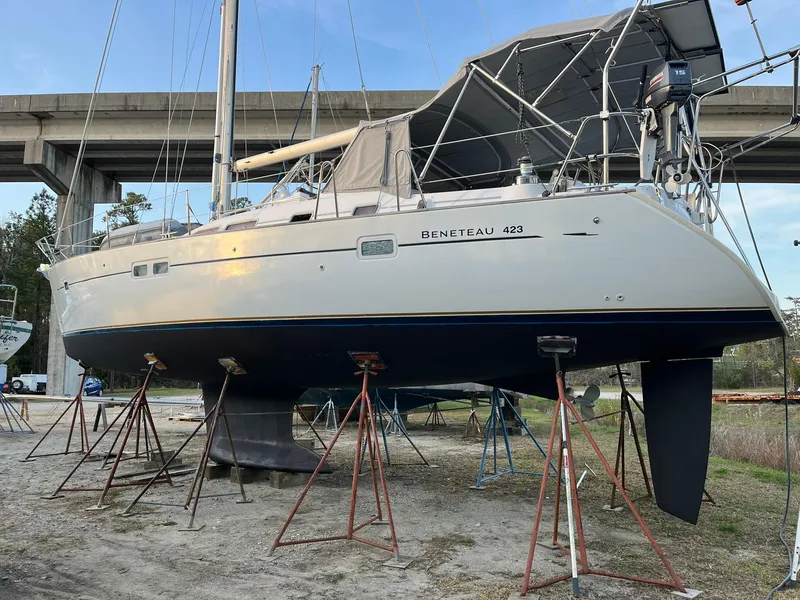 Slide: The Image of 2007 Beneteau 423 sailboat on stands, under a bridge, ready for maintenance. - 5