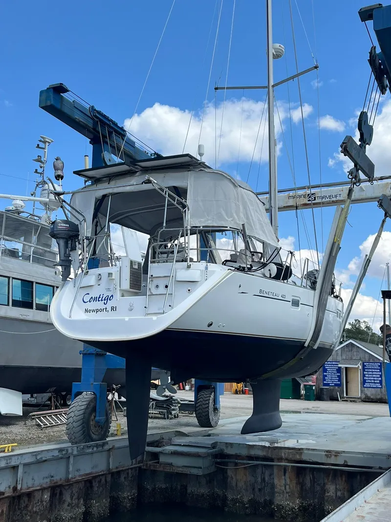 Slide: The Image of Beneteau 423 sailboat from 2007 in a boatyard lift, Newport, RI. - 9