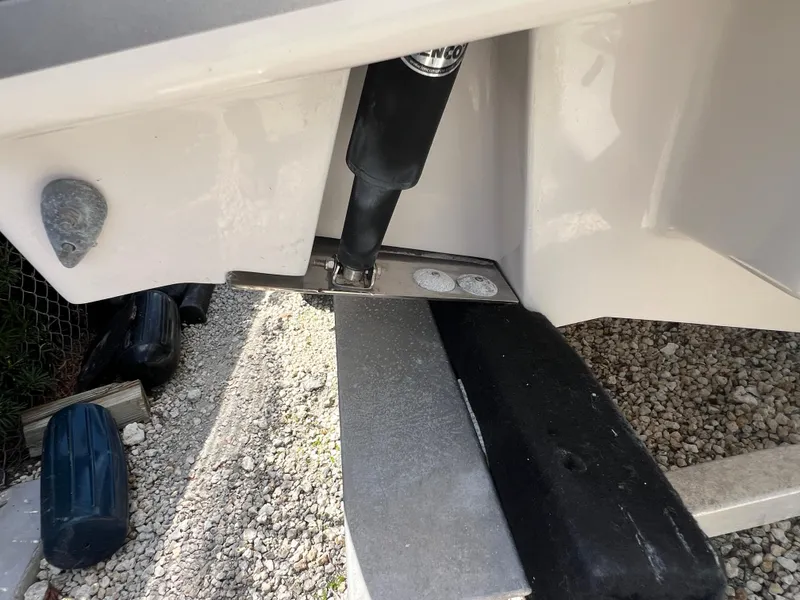 Slide: The Image of 2016 Pursuit S 280 Sport boat detail showing trim tab and hydraulic system. - 13