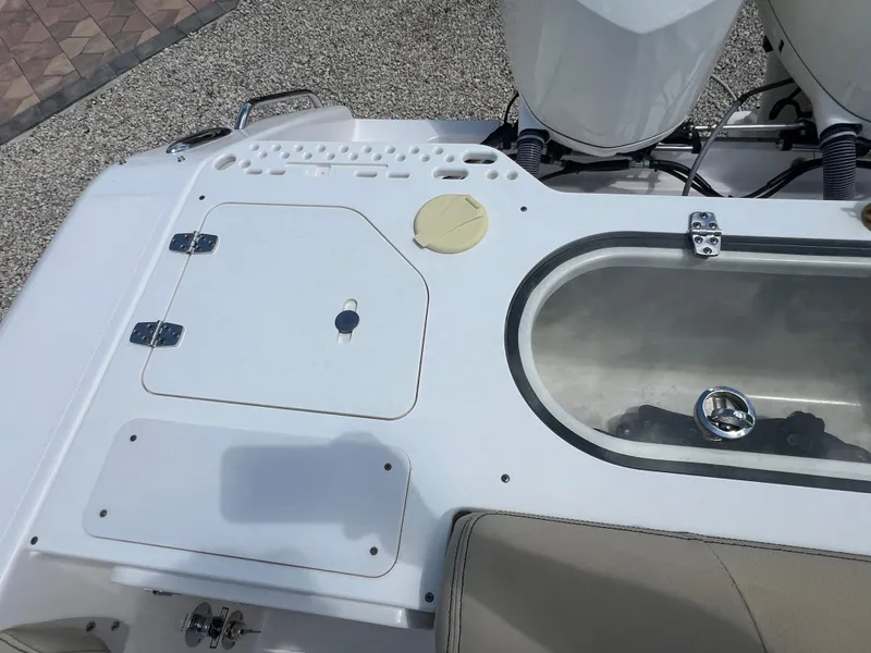 Slide: The Image of 2016 Pursuit S 280 Sport boat deck with storage compartments and seating. - 24