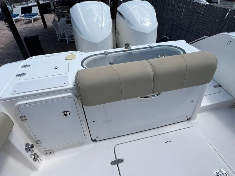 Slide: The Image of 2016 Pursuit S 280 Sport boat deck with seating and storage compartments. - 26