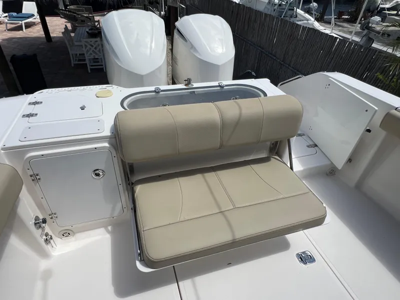 Slide: The Image of 2016 Pursuit S 280 Sport boat with beige seating and dual engines. - 29