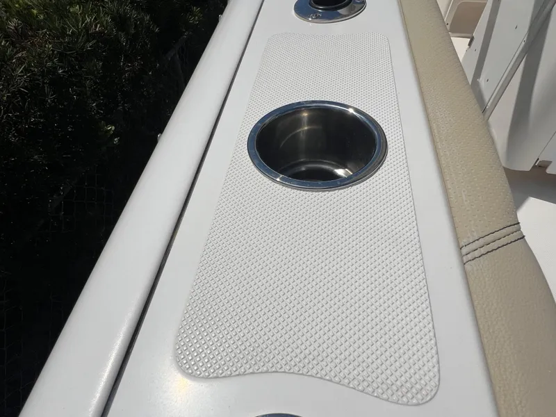 Slide: The Image of 2016 Pursuit S 280 Sport boat cup holders with textured surface. - 32