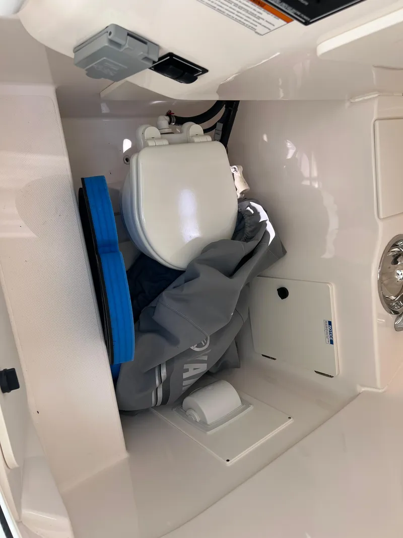 Slide: The Image of 2016 Pursuit S 280 Sport boat interior with compact marine toilet. - 39