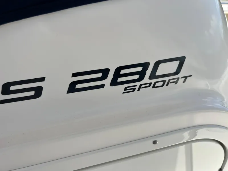 Slide: The Image of 2016 Pursuit S 280 Sport boat logo on white surface. - 45