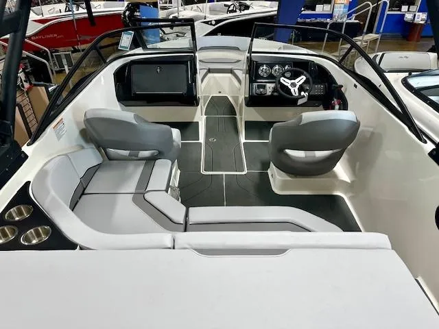 Slide: The Image of 2025 Bayliner V20i boat interior with modern seating and sleek dashboard design. - 3