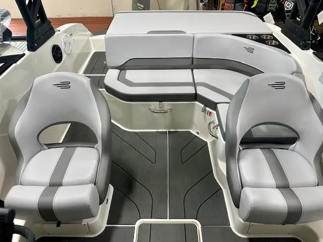 Slide: The Image of 2025 Bayliner V20i boat interior with modern gray seating and sleek design. - 4
