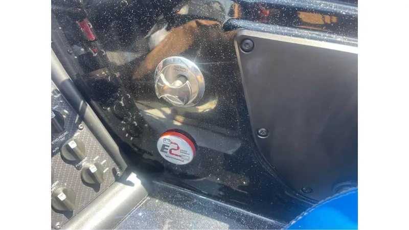 Slide: The Image of Control panel of a 2025 Phoenix 721 ZXL boat, featuring various switches and a gauge. - 10