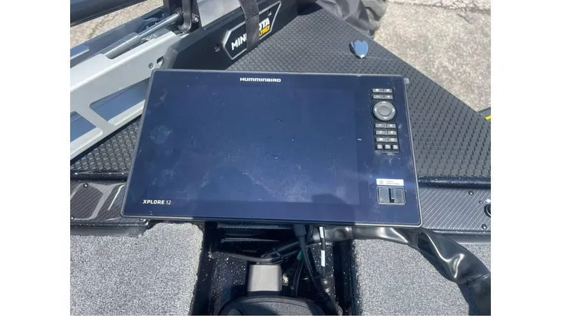 Slide: The Image of 2025 Phoenix 721 ZXL boat dashboard with Humminbird Xplore 12 display. - 12