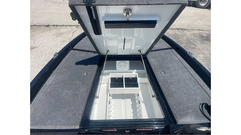 Slide: The Image of Open storage compartment of 2025 Phoenix 721 ZXL boat, showcasing interior design. - 15