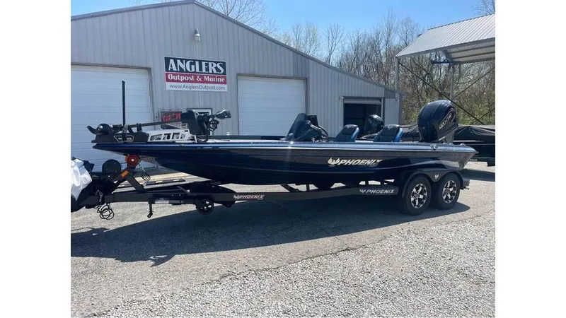 Slide: The Image of 2025 Phoenix 721 ZXL boat on trailer outside Anglers Outpost & Marine. - 3