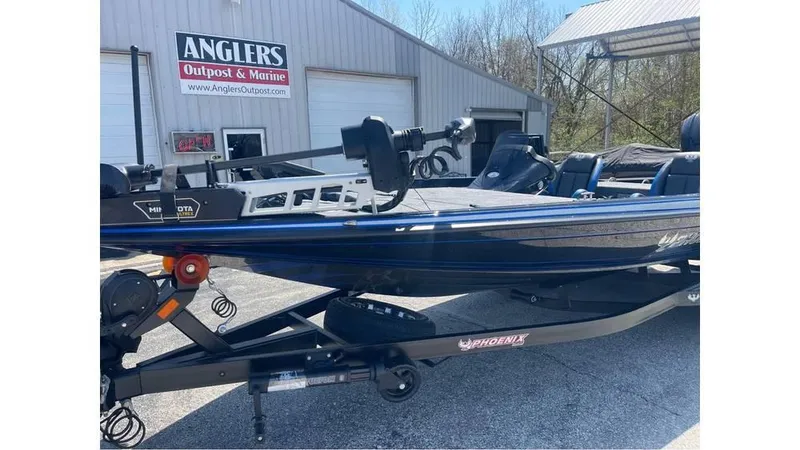 Slide: The Image of 2025 Phoenix 721 ZXL boat at Anglers Outpost & Marine dealership. - 4