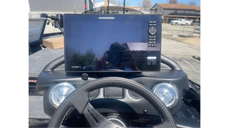 Slide: The Image of 2025 Phoenix 721 ZXL dashboard with Humminbird fishfinder and steering wheel. - 8