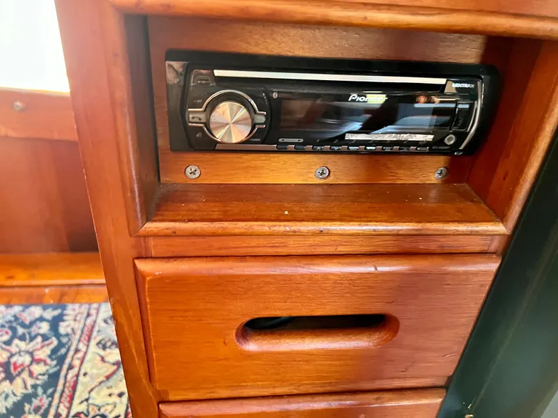 Slide: The Image of Wooden interior of 1985 Grand Banks 42 Motoryacht with built-in Pioneer stereo system. - 27