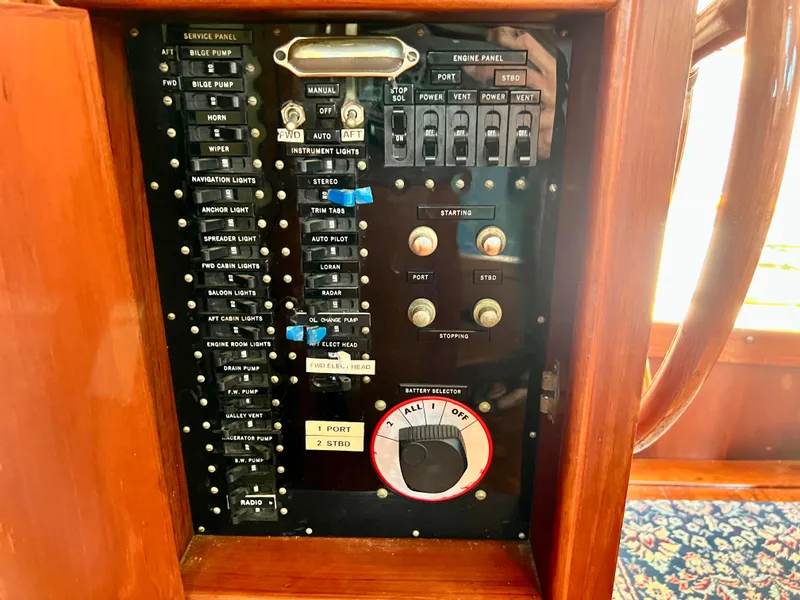 Slide: The Image of Control panel of a 1985 Grand Banks 42 Motoryacht with switches and dials. - 43
