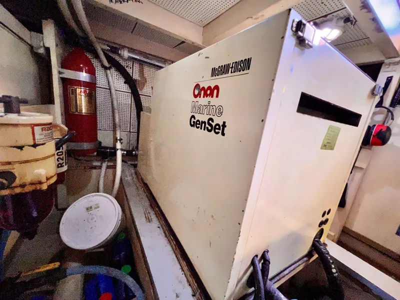 Slide: The Image of Engine room of 1985 Grand Banks 42 Motoryacht with Onan Marine GenSet generator. - 44