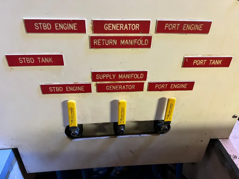 Slide: The Image of Control panel of a 1985 Grand Banks 42 Motoryacht with labeled engine and tank switches. - 45