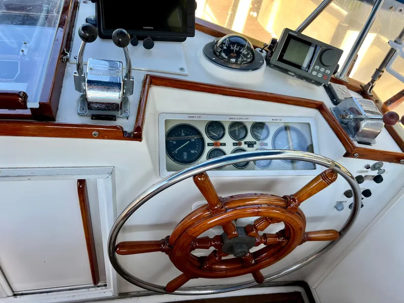 Slide: The Image of Helm of 1985 Grand Banks 42 Motoryacht with wooden wheel and navigation instruments. - 9