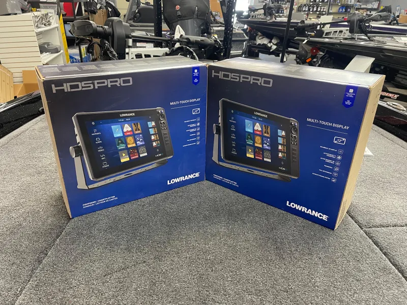 Slide: The Image of Boxes of Lowrance HDS PRO displays on a Phoenix 21 XE boat, 2025 model. - 12