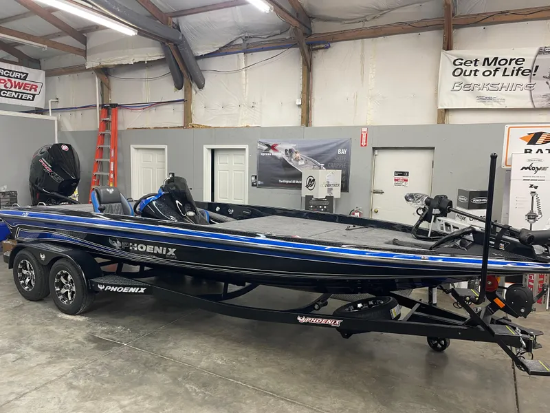 Slide: The Image of 2025 Phoenix 21 XE boat in a garage, featuring sleek design and modern equipment. - 4