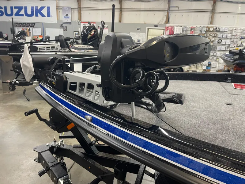 Slide: The Image of 2025 Phoenix 21 XE boat with advanced equipment in a showroom setting. - 6