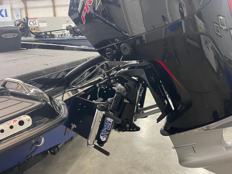 Slide: The Image of 2025 Phoenix 21 XE boat motor and hydraulic system in a showroom setting. - 9