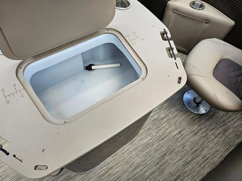 Slide: The Image of Interior of 2020 Bennington 22 SSXP boat showing storage compartment and seating. - 10