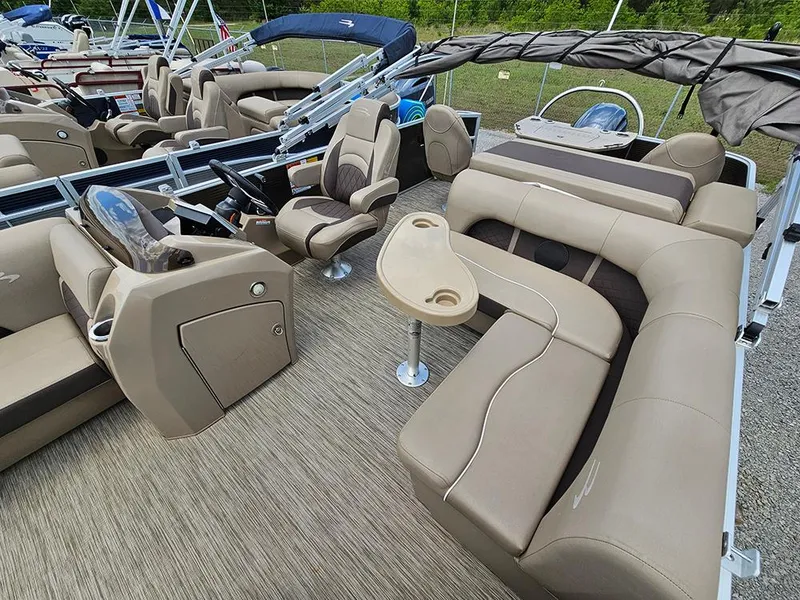 Slide: The Image of 2020 Bennington 22 SSXP pontoon boat interior with beige seating and table. - 12