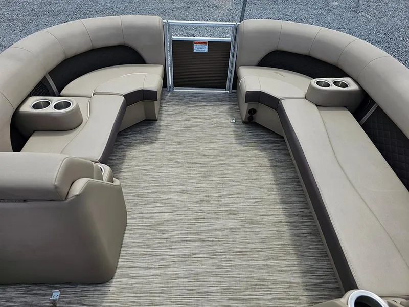 Slide: The Image of 2020 Bennington 22 SSXP pontoon boat interior with beige seating and cup holders. - 17